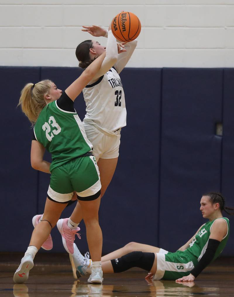 Crystal Lake South's Laken LePage fouls Cary-Grove's Olivia Leuze as ehe shoots the ball during a Fox Valley Conference girls basketball game on Tuesday, Dec. 2, 2025, at Cary-Grove High School in Cary.