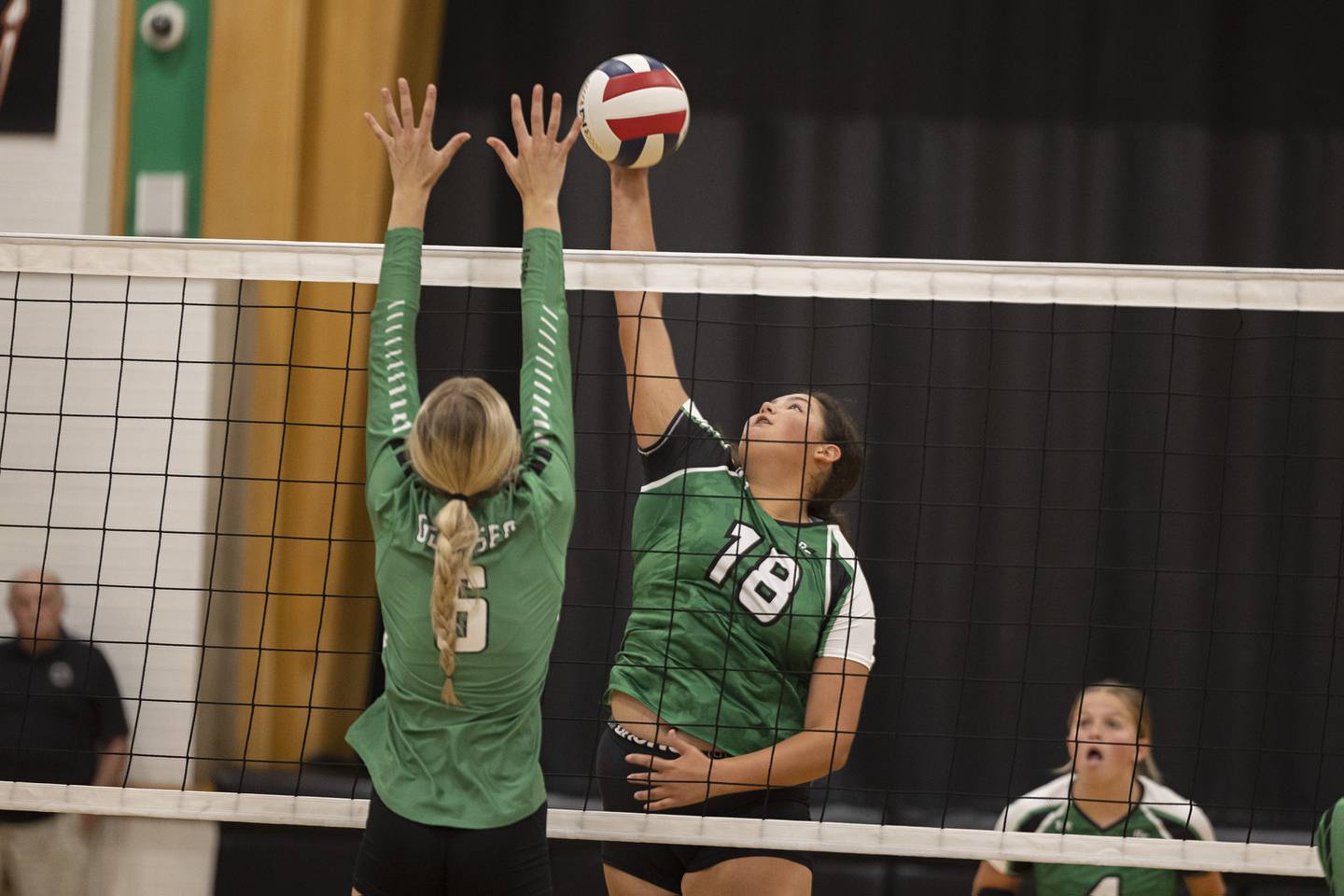 Rock Falls’ Ari Reyna spikes against Geneseo’s Kendall Ellerbrock Tuesday, August 22, 2023.