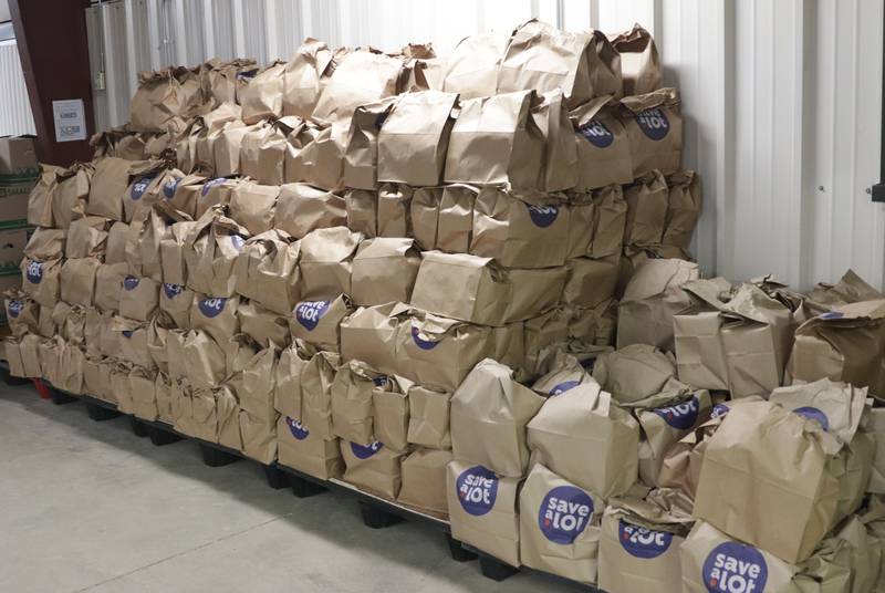 Pallets of grocery sacks are stacked for the Thanksgiving Distribution on Wednesday, Nov. 19, 2025 at the Illinois Valley Food Pantry in Peru. Nearly 500 families or roughly 1,200 people in the Illinois Valley got a Thanksgiving meal.