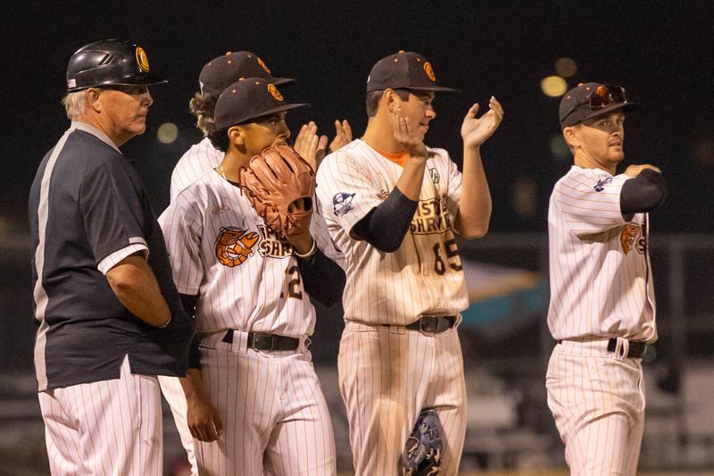 Pistol Shrimp players give a standing ovation as senior Tyler Dorsch is substituted out of the game for the final time as a part of the team on Thursday, July 31, 2025, at Schweickert Stadium in Peru.