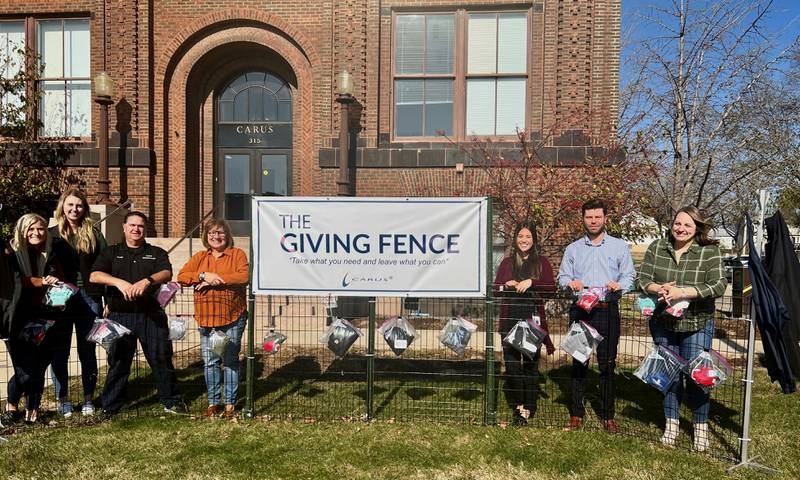 Carus employees Ashley Gatza, Ashley Swingel, Todd Chipman, Sue Weber, Melissa Trilikis, Shane
Schultz and JoLynn Anzelc pose for a photo at the 2022 Giving Fence in Peru.