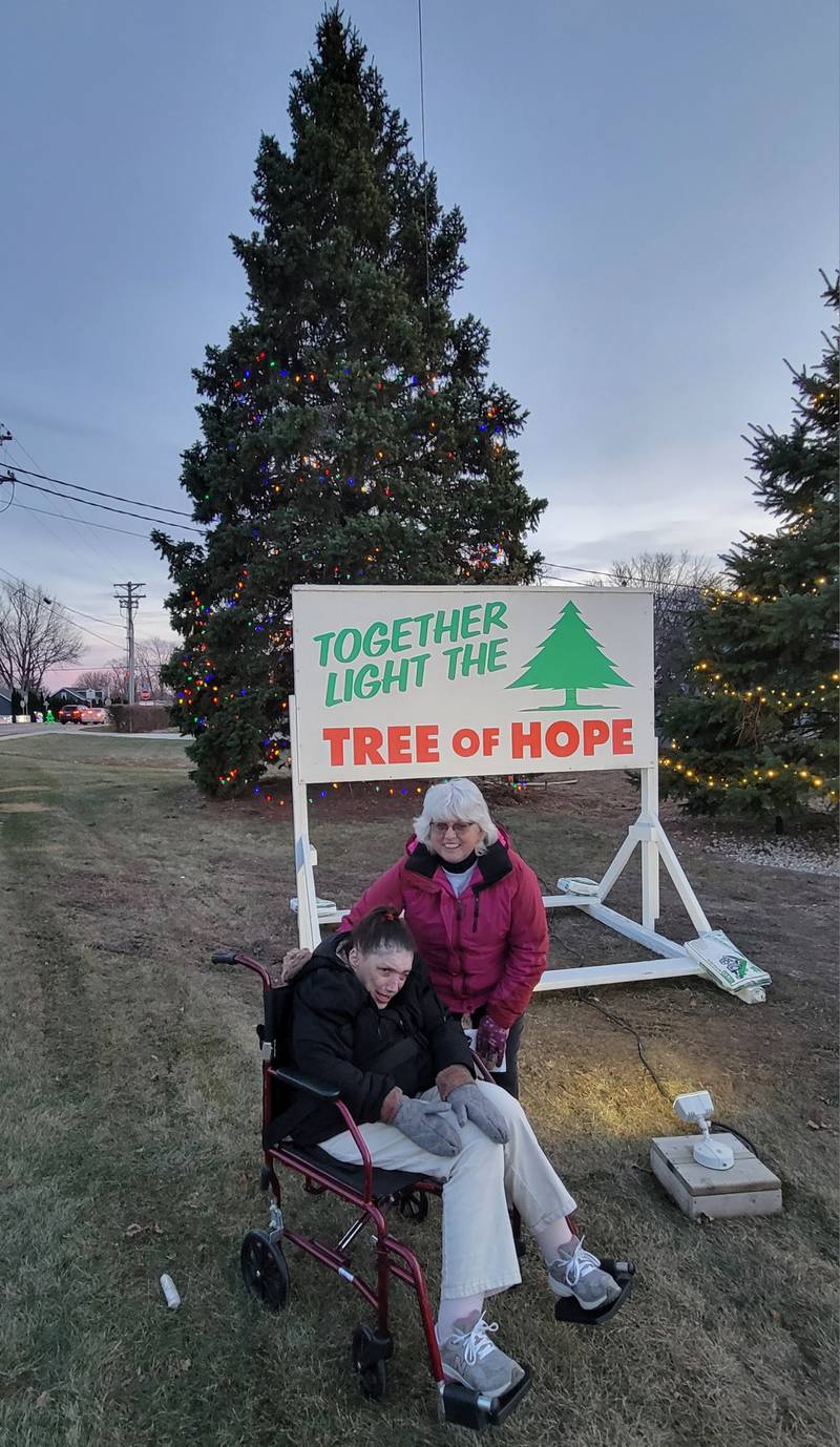 Steffanie Van Laarhoven, the chairperson for the Horizon House’s 2024 Tree of Hope campaign, and Horizon House CEO Michelle Rich pause before the tree lit for the first time last Friday afternoon near the offices on Plank Road in Peru. The campaign, which lights a bulb on the tree for every $50 in donations received in December, is nearing its goal of 1,200 bulbs or $60,000 to fund Horizon House’s Personal Support Worker, Community Employment and Community Day Service programs. Through the lighting of the tree on Friday, there are a total of 925 bulbs lit and $46,251.45 raised, so there is still work to be done. Anyone interested in lighting a bulb with any size donation can contact Horizon House, 4140 Progress Blvd., Peru, IL 61354 or call 815-223-4488.