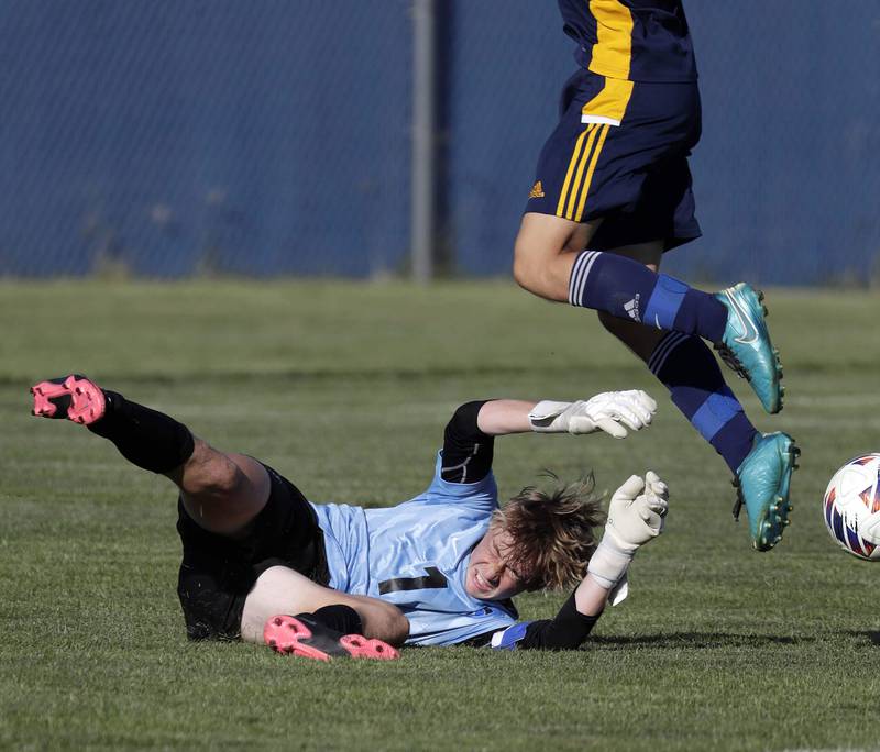 St Charles North's Alexander Curtis (1) stops a shot by Neuqua Valley's Derek Sisbarro (9) Thursday September 8, 2022 in Naperville.