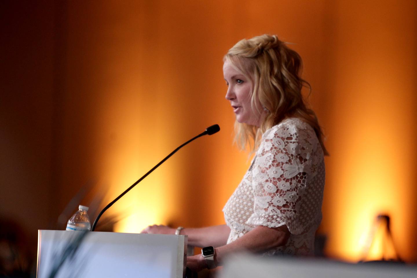 Laura Shaw, chairman of the board of the St. Charles Chamber of Commerce, announces the winner of the Charlemagne Award during the 55th Annual Charlemagne Awards Dinner at the Q Center in St. Charles on Friday, May 19, 2023.