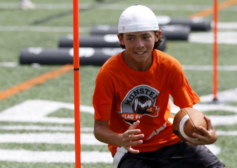 Vinny Abbate runs a drill during the Chicago Bears Mini Monsters Flag Football Camp on Wednesday, July 16, 2025. at McCracken Field in McHenry.