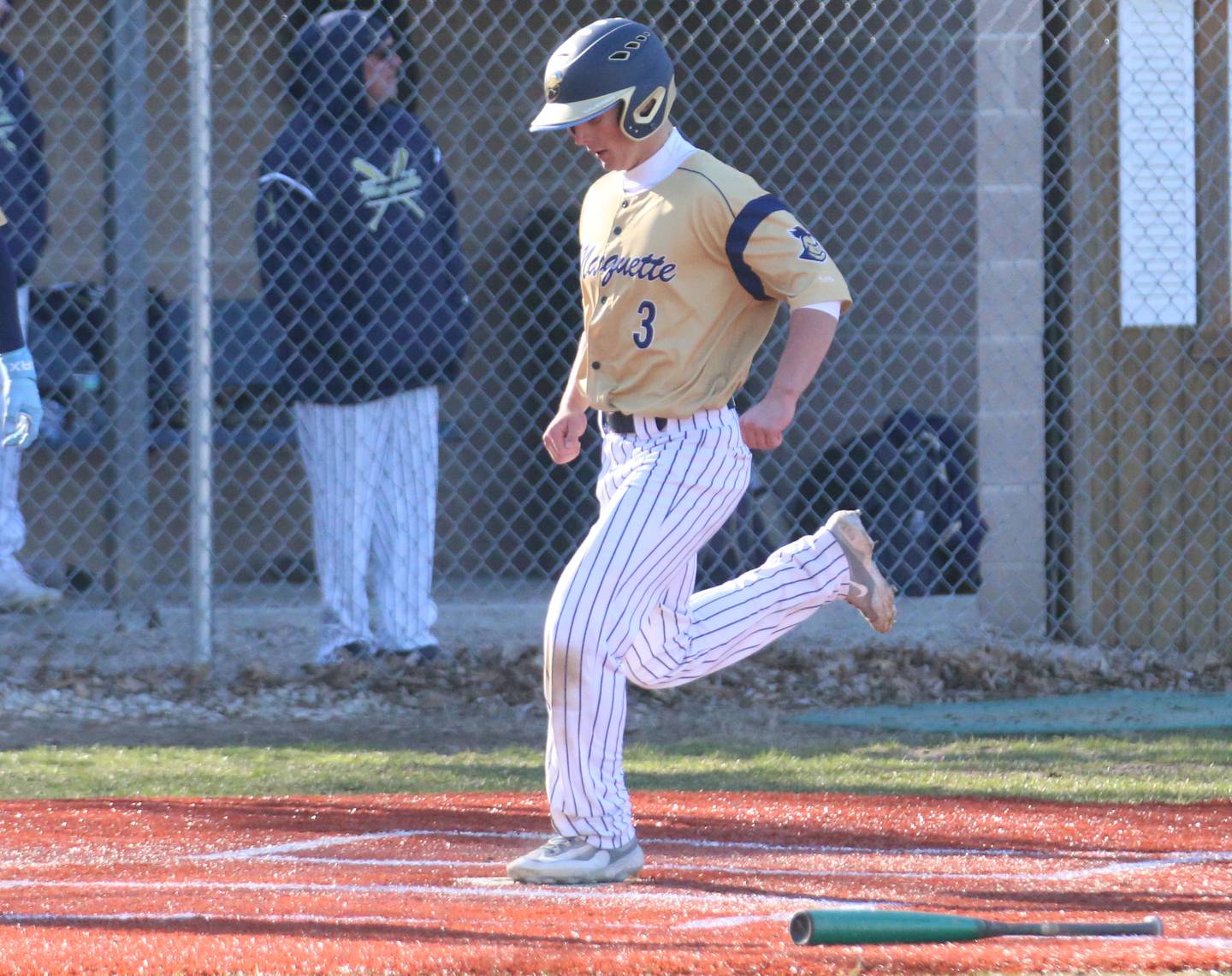 Marquette's Beau Thompson scores a run against Newark on Monday, March 23, 2026 at Newark High School.