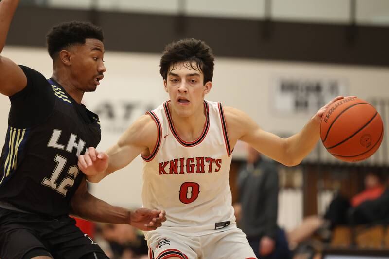 Lincoln-Way Central’s Ben McLaughlin works against Lemont’s Miles Beachum in the Lincoln-Way West Warrior Showdown on Saturday January 28th, 2023.