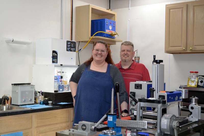 Jen Brooks (left) and Nick Brooks pose for a photo on Saturday, Nov. 2, 2024, inside the workshop of Brooks Jewelers. Jen Brooks is the primary owner and Nick Brooks the co-owner of the Oregon-based store.