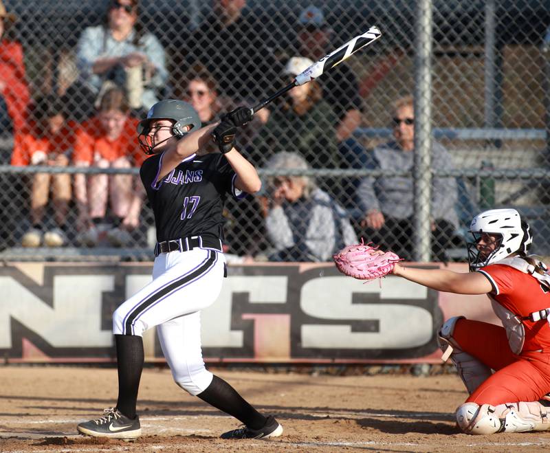 Downers Grove North's Viktoria Czech watches where her ball goes during a game against St. Charles East on Friday, March 28, 2025 in St. Charles.