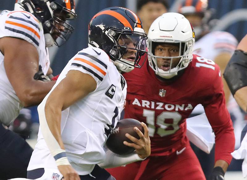 Chicago Bears quarterback Justin Fields finds a hole in the Arizona Cardinals defense during their game Sunday, Dec. 24, 2023, at Soldier Field in Chicago.