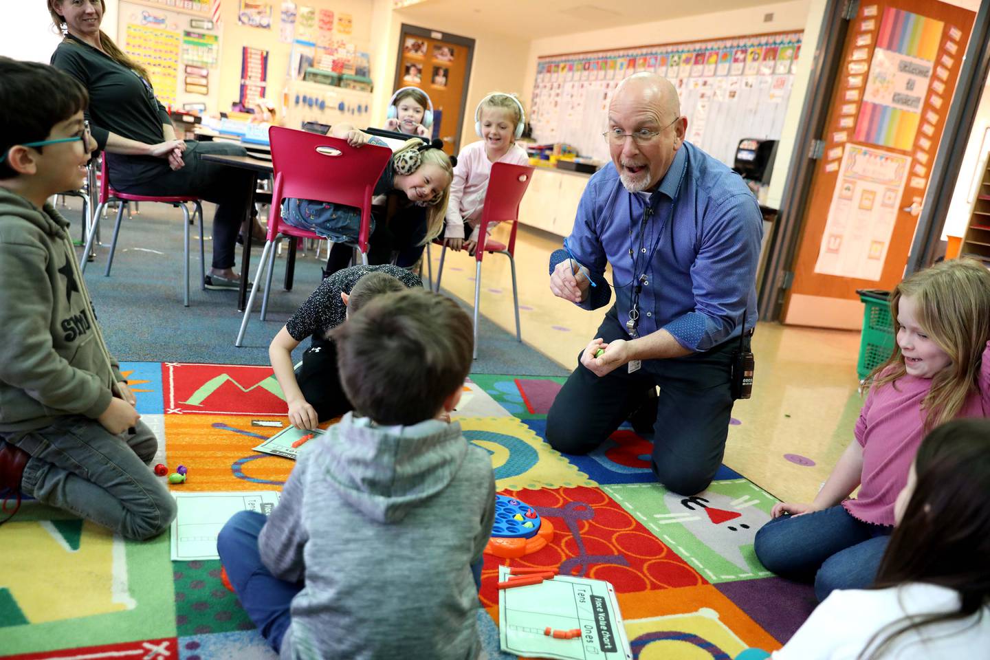 Principal Ron Zeman chats with kindergartners at Western Avenue Elementary School in Geneva. Zeman will be retiring June 30. He has been in education for 33 years, 23 of them as an administrator, 8 as teacher, 5 as special ed coop consultant.