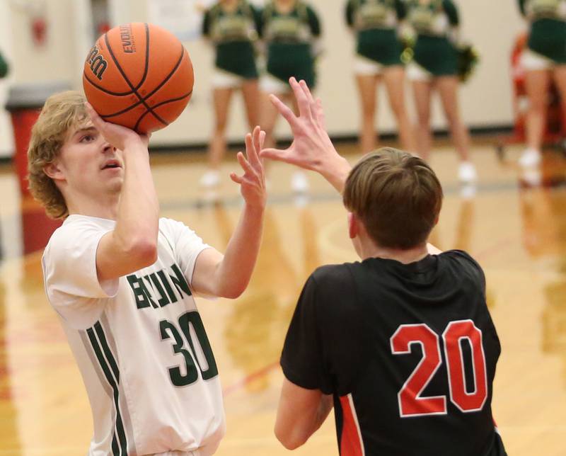 St. Bede's Kaden Newman eyes the basket as Stillman Valley's Ian Seper defends during the 49th annual Colmone Class on Thursday, Dec. 7, 2023 at Hall High School.