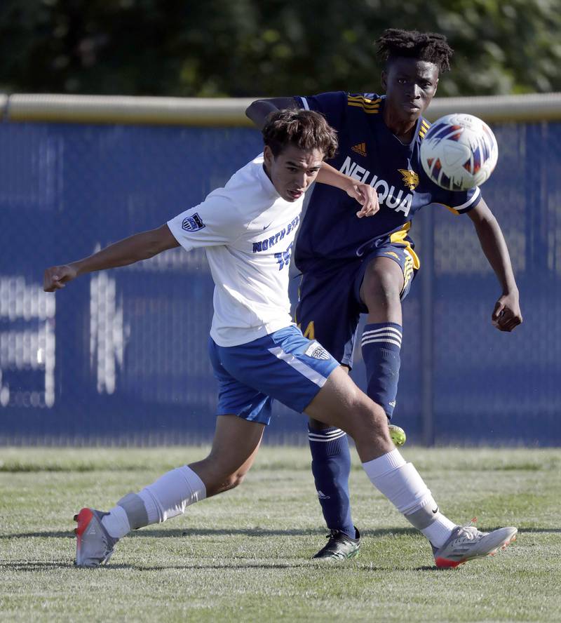 St Charles North's Blake Taylor (15) can’t get to Neuqua Valley's Ayel Kikama (14)  before he clears the ball Thursday September 8, 2022 in Naperville.