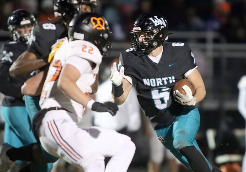 Woodstock North’s Braden Schnake runs the ball against Freeport in first-round IHSA Playoff football action on Saturday, Nov. 2, 2024 at Woodstock North High School in Woodstock.
