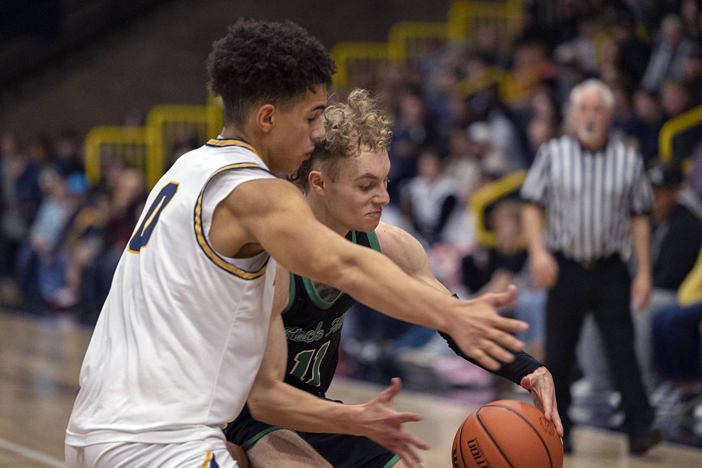 Rock Falls’ Gavin Sands works the ball against Sterling’s Andre Klaver on Tuesday, Nov. 29, 2022.