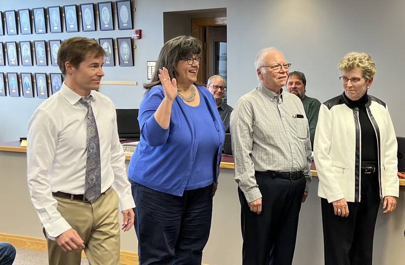 Fourth Ward Alderperson Ben Bumpus, Third Ward Alderperson Nancy Copple, Second Ward Alderperson Chuck Stowe and First Ward Alderperson Alicia Cosky gather together to be sworn-in as Sycamore City Council members on May 1, 2023