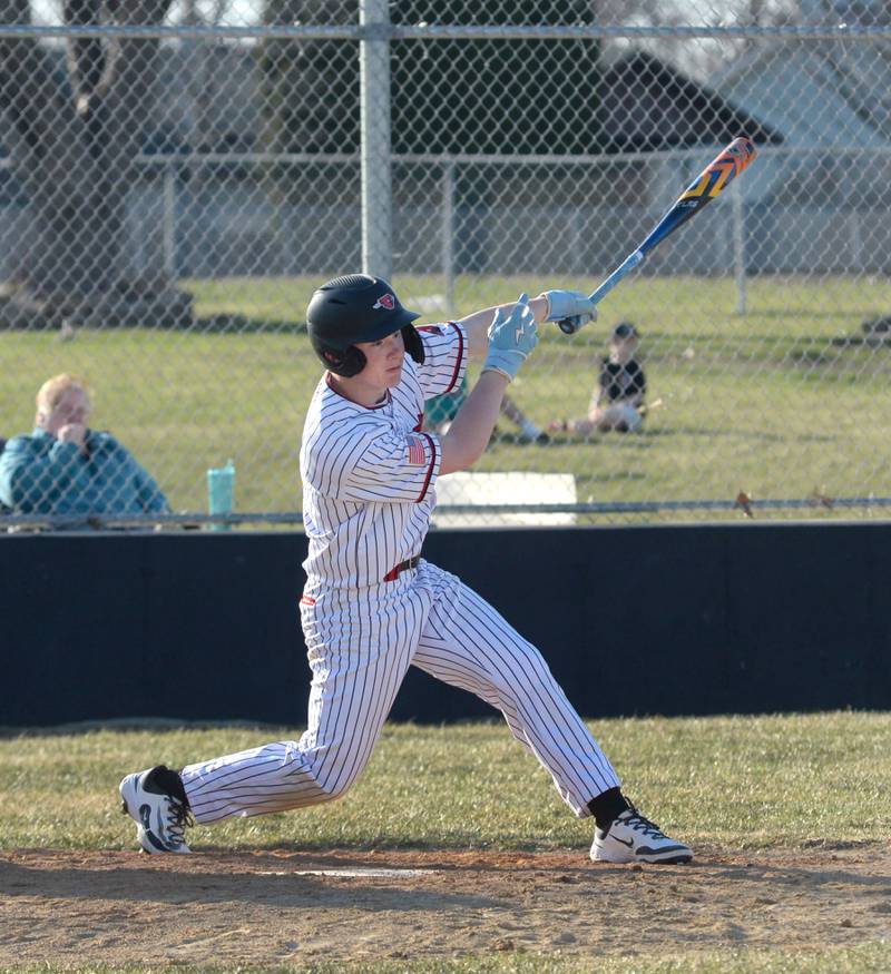 Forreston's Connor Politsch watches the ball as he connects on a pitch against Warren/Stockton on Friday, March 28, 2025 in Forreston.