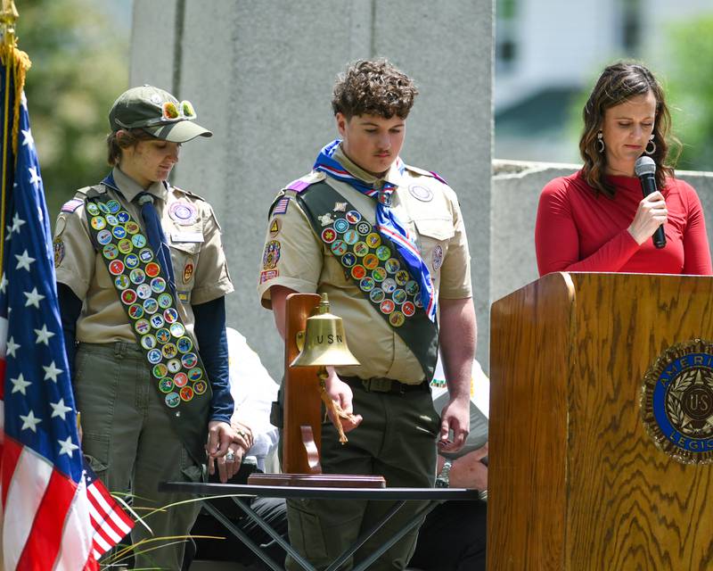 Scouts Lynze Jeffries, left, and Nick Varlotta, take turns ringing the ball as each name on the base of the memorial monument was read by Yorkville’s Superintendent of Park and Req Shay Remus on Monday May 26, 2025, during the Memorial Day event held at Town Square Park in Yorkville.