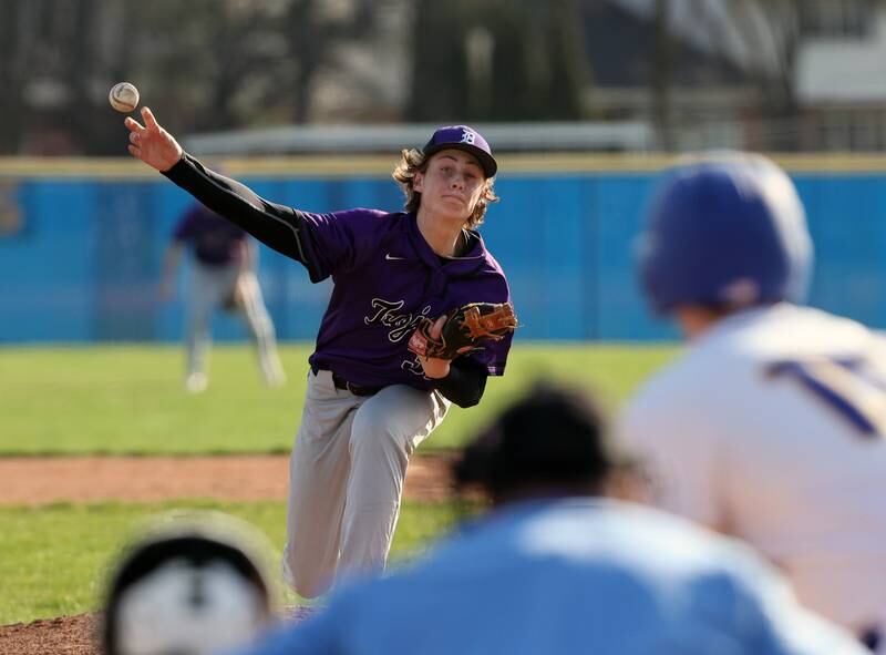 Downers Grove North's Ben Llewellyn (32) throws a pitch during the boys varsity baseball game between Lyons Township and Downers Grove North high schools in Western Springs on Tuesday, April 11, 2023.