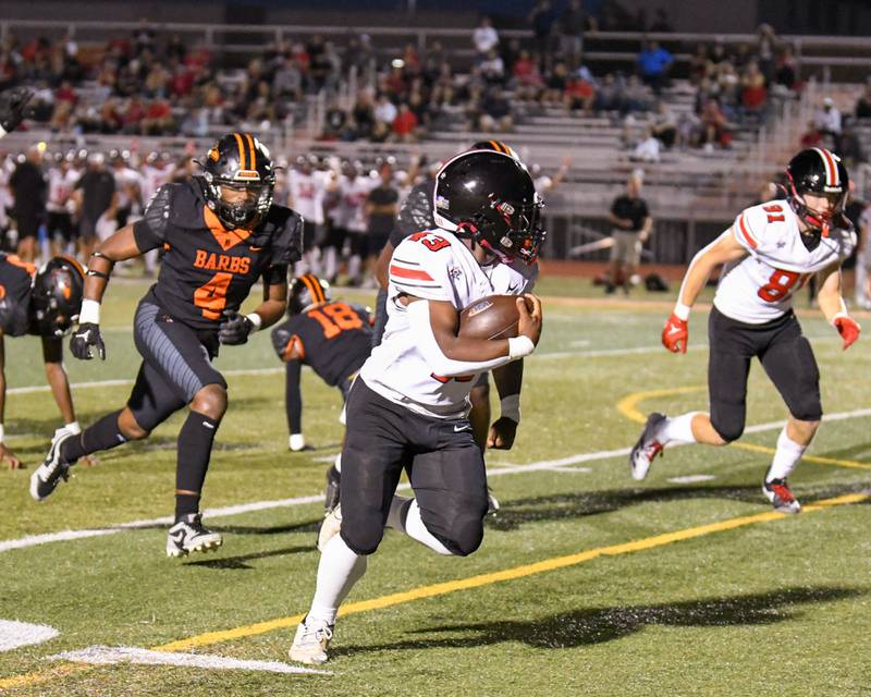 Lincoln-Way Central's Justin Cobbs (43) runs the ball in for a touchdown on Friday Sept. 20, 2024, while traveling to take on DeKalb High School in Dekalb.