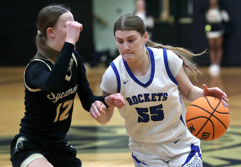 Burlington Central's Scarlett LaFleur tries to go by Sycamore's Sadie Lang Thursday, Feb. 19, 2026, during their Class 3A regional championship game at Sycamore High School.