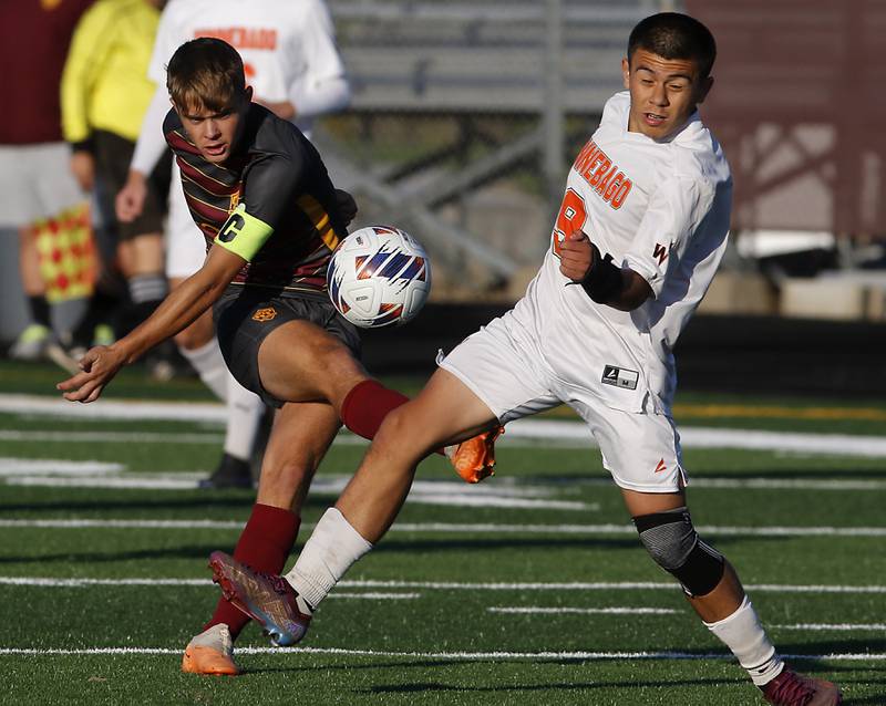 Richmond-Burton's Maddox Meyer takes a shot on goal as he is defended by Winnebago's Daniel Guzman during the IHSA Class 1A Richmond-Burton Regional Final soccer match Tuesday, Oct. 17, 2023, at Richmond-Burton High School in Richmond.