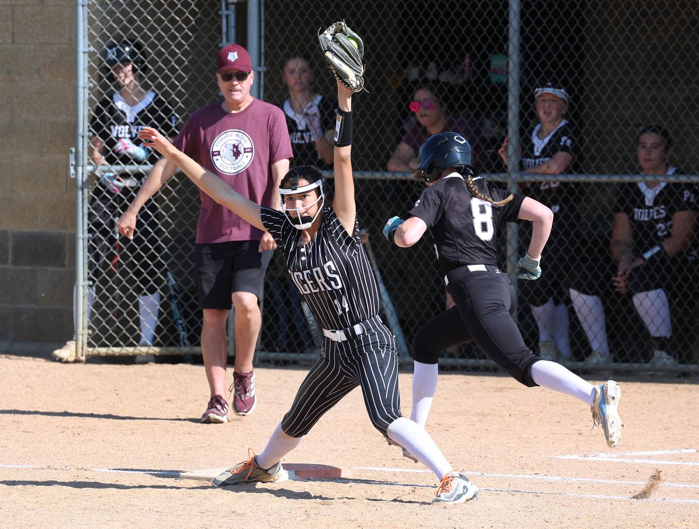 Prairie Ridge's Adysen Kiddy is just out at first as Crystal Lake Central's Lily Perocho takes the throw Friday, June 6, 2025, during their Class 3A sectional final game at Sycamore High School.
