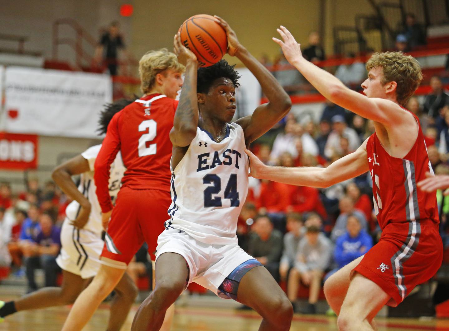 Oswego East's Mekhi Lowery (24) looks to get past the defense during the Hinsdale Central Holiday Classic championship game between Oswego East and Hinsdale Central high schools on Thursday, Dec. 29, 2022 in Hinsdale, IL.