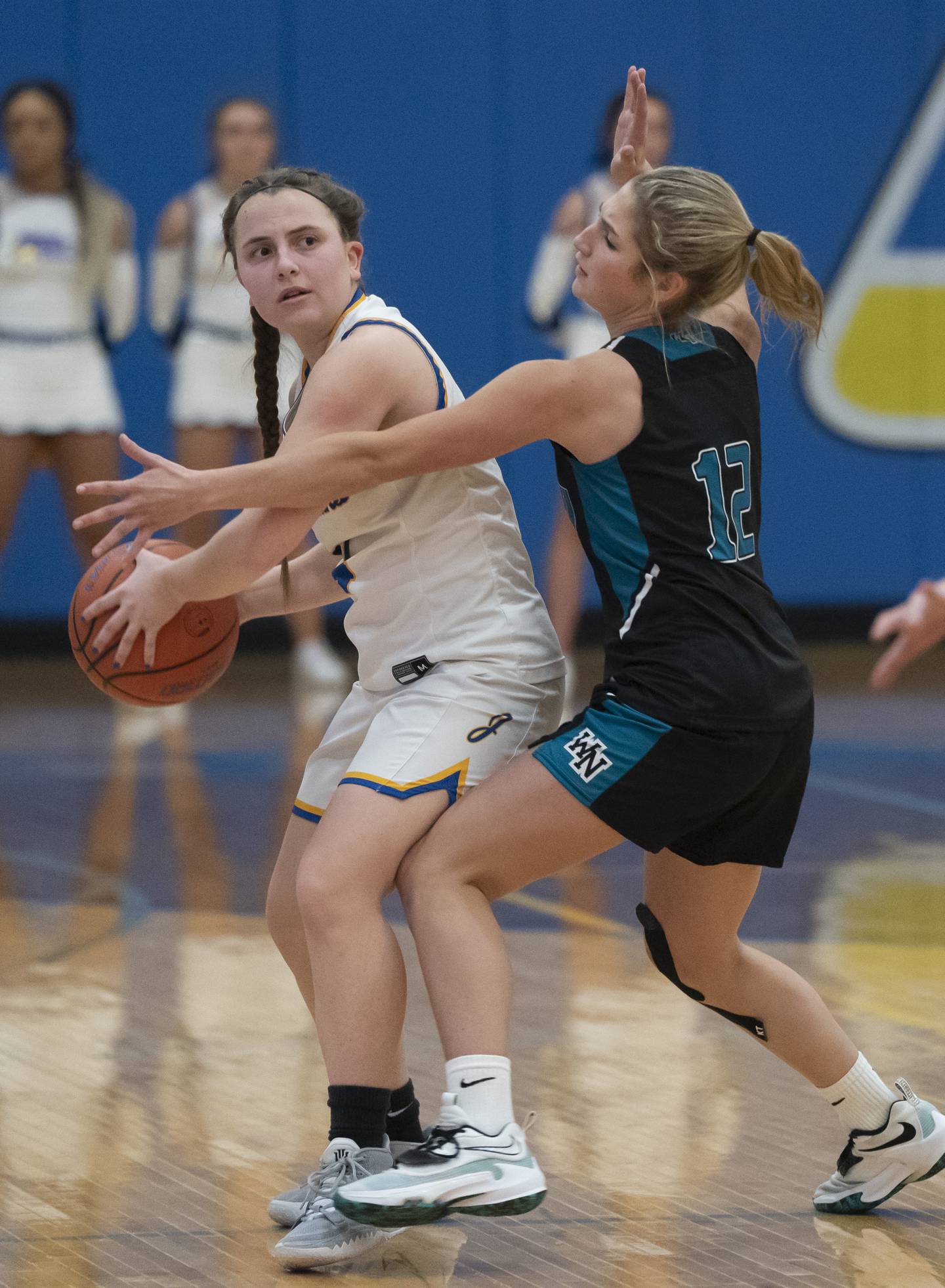 Johnsburg's Payton Toussaint looks to pass under pressure from Woodstock North's Addison Rishling during their game on Tuesday, February 8, 2022 at Johnsburg High School. Woodstock North won 48-37. Ryan Rayburn for Shaw Local