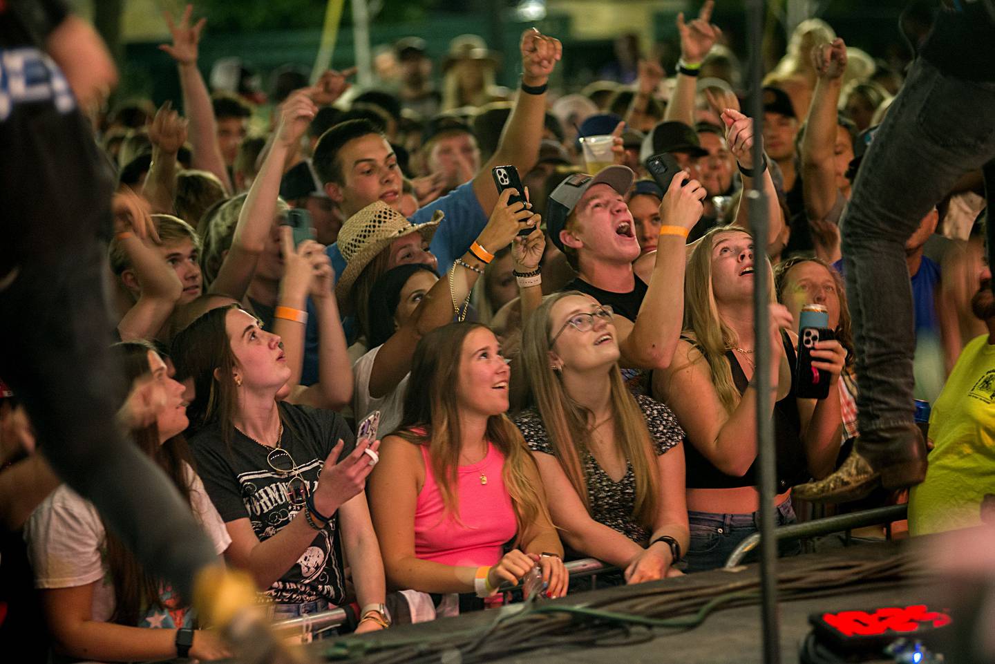 Music fans celebrate Friday night headliner Travis Denning July 1, 2022 at Dixon’s Petunia Fest. Lots more music to be heard on Saturday and Sunday at the festival.