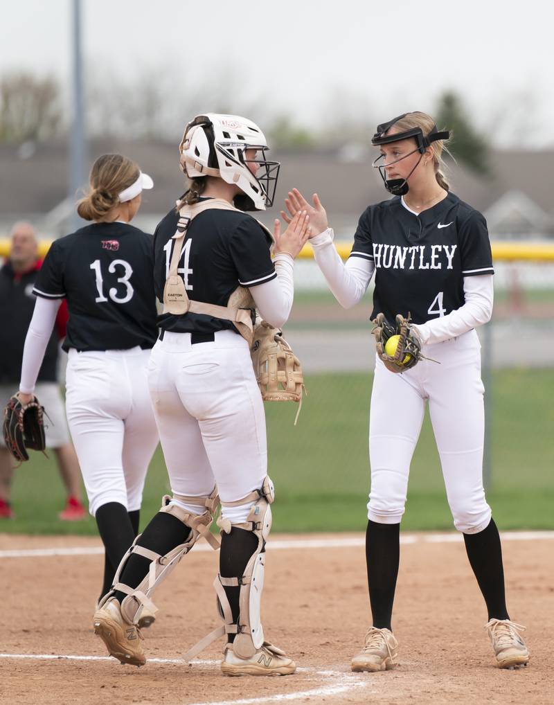 Huntley catcher Madison Rozanski and pitcher Layla Olson high five each other during their game against McHenry on Wednesday, April 30, 2025 at Huntley High School. Ryan Rayburn for Shaw Local