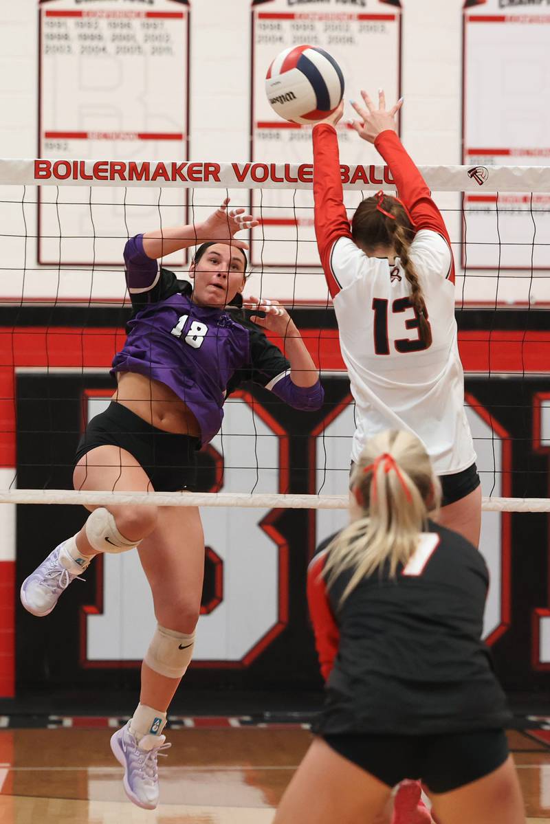 Manteno's Maddie Gesky finishes her swing as Bradley-Bourbonnais' Harper Yuska (13) and Hannah Wojnowski jump to block during the Panthers' victory in three sets, 25-21, 23-25, 25-17, over the Boilermakers on Monday, Sept. 15, 2025.