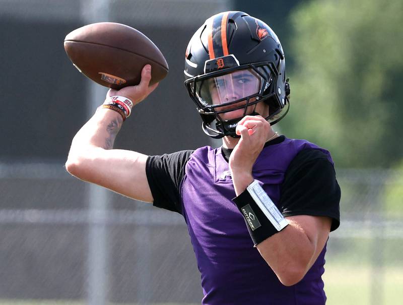DeKalb’s Cole Latimer throws a pass Monday, Aug. 11, 2025, during their first fall practice at the school.