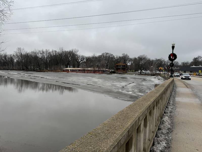 Cars travel along Illinois Route 53 in Wilmington as the road was opened up again Friday, Jan. 26 following flooding along the Kankakee River.