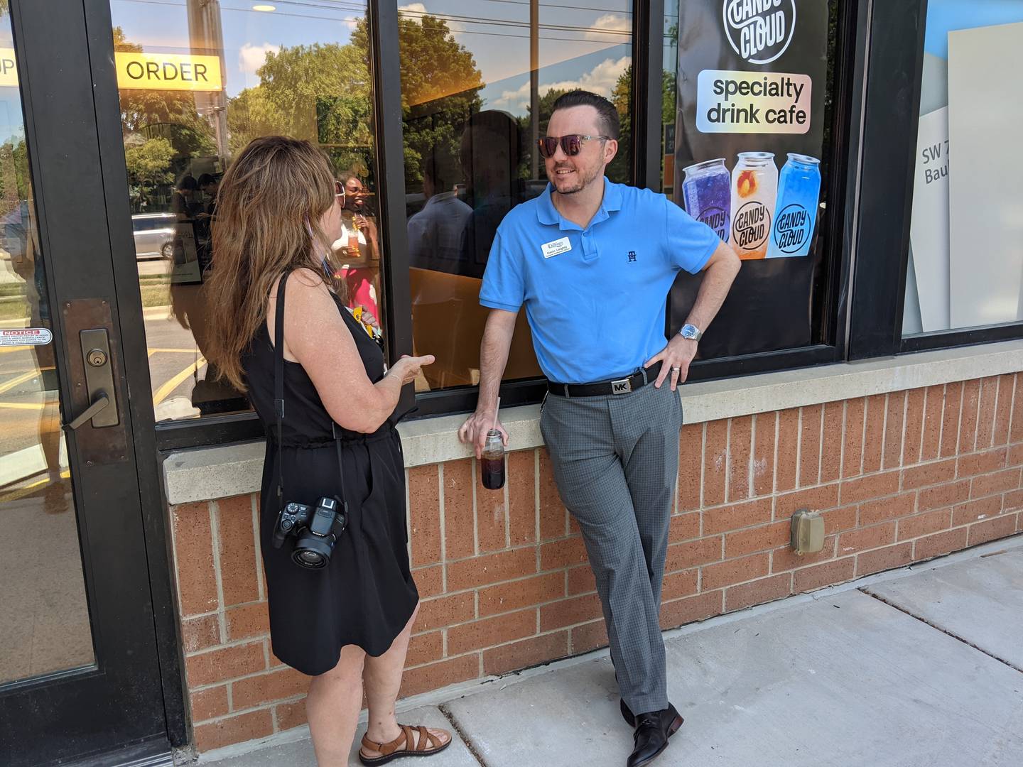 Oswego Economic Development Director Kevin Leighty, right, and Angie Hibben, president/chief executive officer of the Oswego Area Chamber of Commerce, left, attended Candy Cloud's soft opening on Tuesday, July 1. The Chamber of Commerce also hosted a ribbon cutting ceremony for the new store, located at 2832 Route 34, Oswego, next to BIBIBOP Asian Grill.