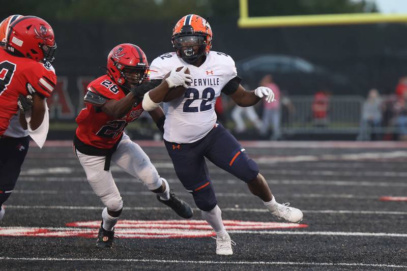 Naperville North’s Lonzo Duckworth rushes to the outside against Bolingbrook on Friday, Sept. 8, 2023 in Bolingbrook.