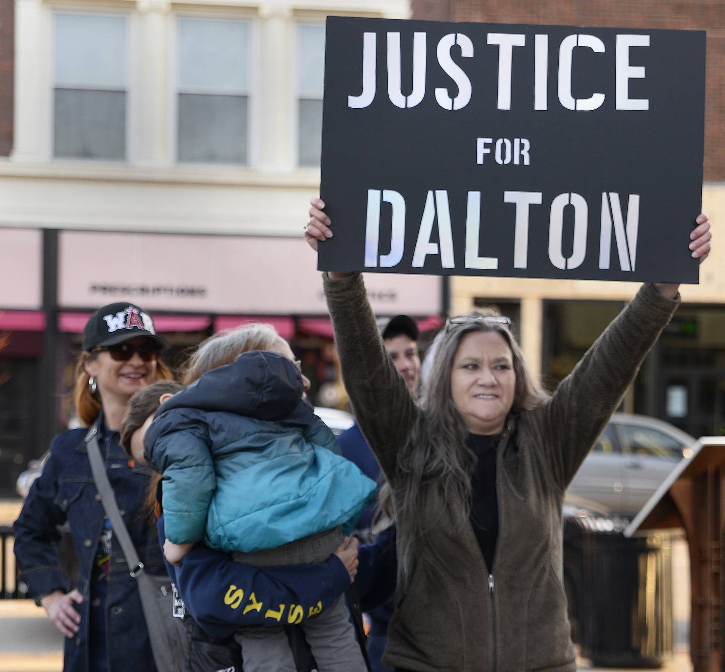 Dalton Mesarchik’s mother Michelle walks through the crowd gathered Sunday, March 26, 2023, at Heritage Park in Streator after a memorial marking the 20th anniversary of her son's murder.