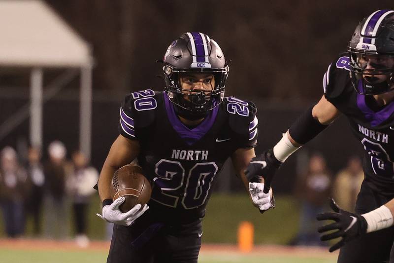 Downers Grove North’s Noah Battle rushes against Mt. Carmel in the Class 7A championship on Saturday, Nov. 25, 2023 at Hancock Stadium in Normal.