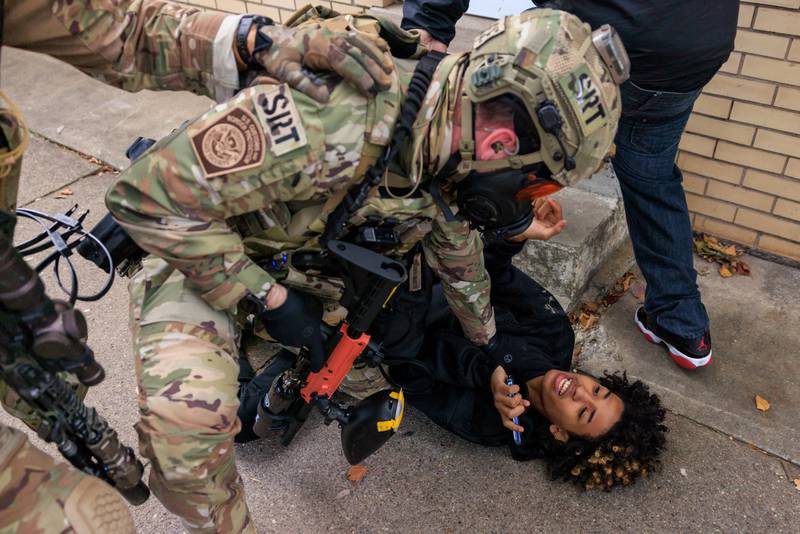 A U.S. Customs and Border Protection agent detains a protester in East Side, Chicago, Tuesday, Oct. 14, 2025. (Anthony Vazquez/Chicago Sun-Times via AP)