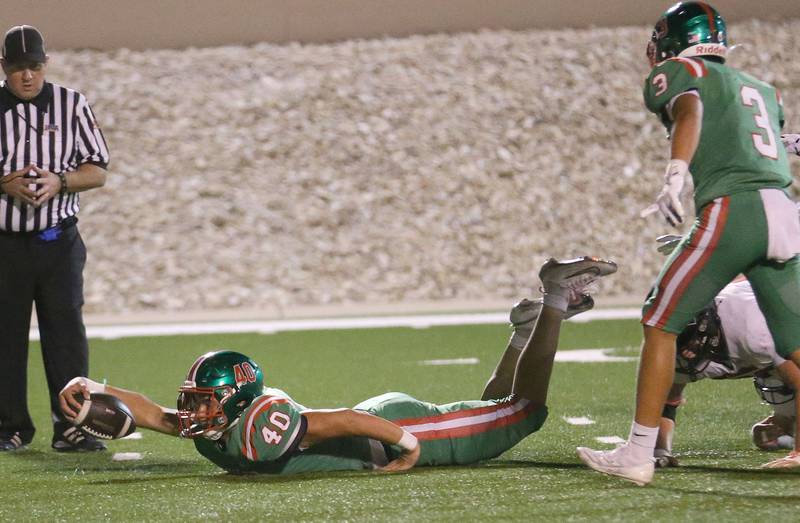 L-P's Nick Hachenberger dives to get an extra yard against Metamora on Friday, Sept. 5, 2025 at Howard Fellows Stadium.