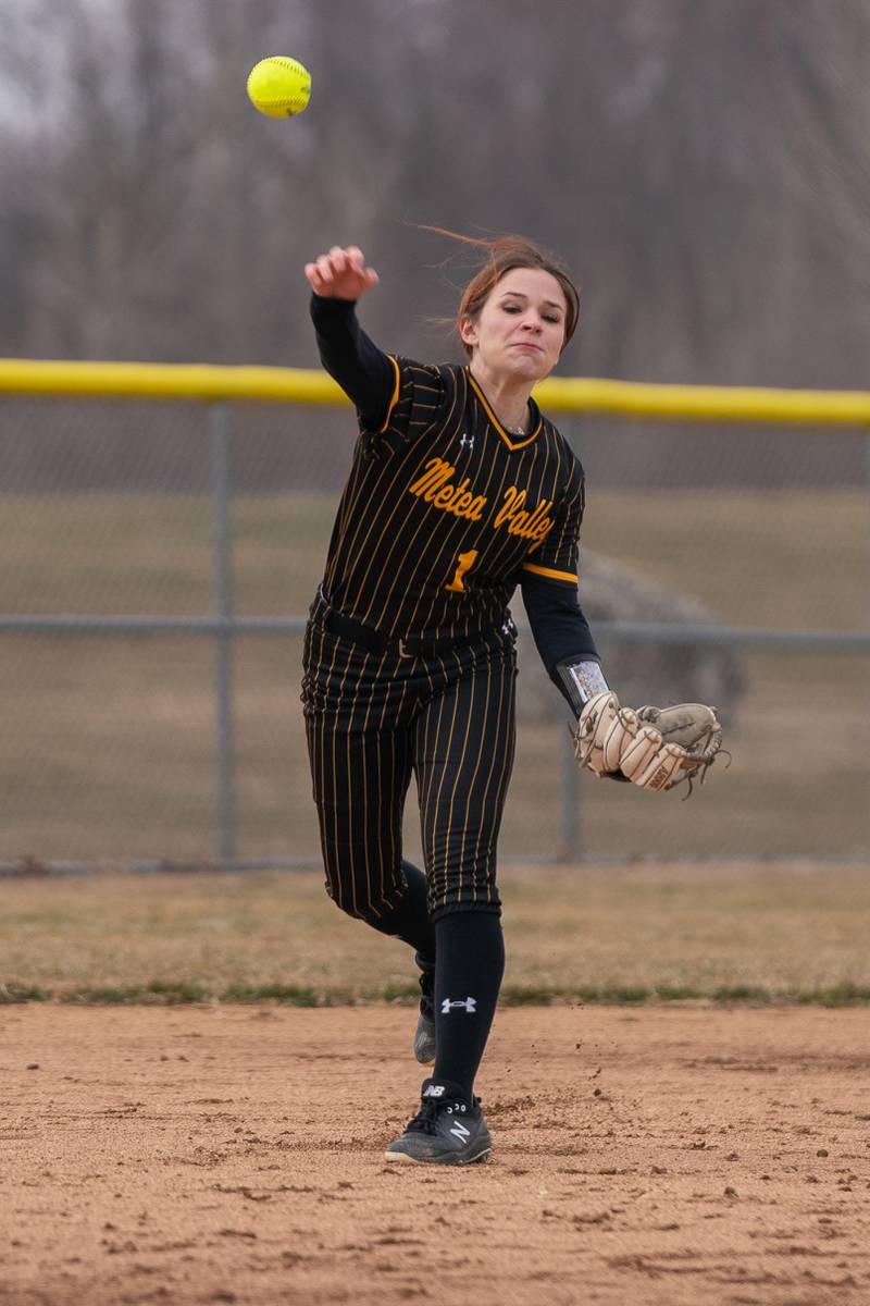 Metea Valley's Reese Valha (1) fields a grounder and throws to first for an out against Oswego East during a softball game at Metea Valley High School in Aurora on Friday, Mar 24, 2023.