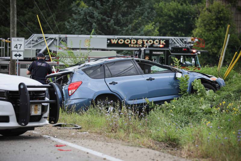 Paramedics triage the scene of a two-car crash near Woodstock Aug. 18, 2024.