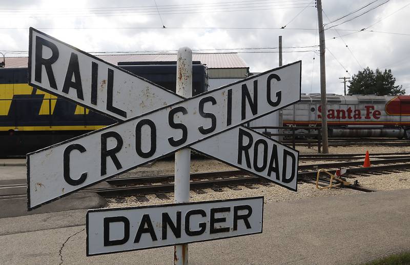 A railroad crossing sign at the Illinois Railway Museum on Friday, Aug. 11, 2023,  the museum is just south of the railroad tracks the proposed Metra route will use to connect Rockford and Huntley with Chicago.