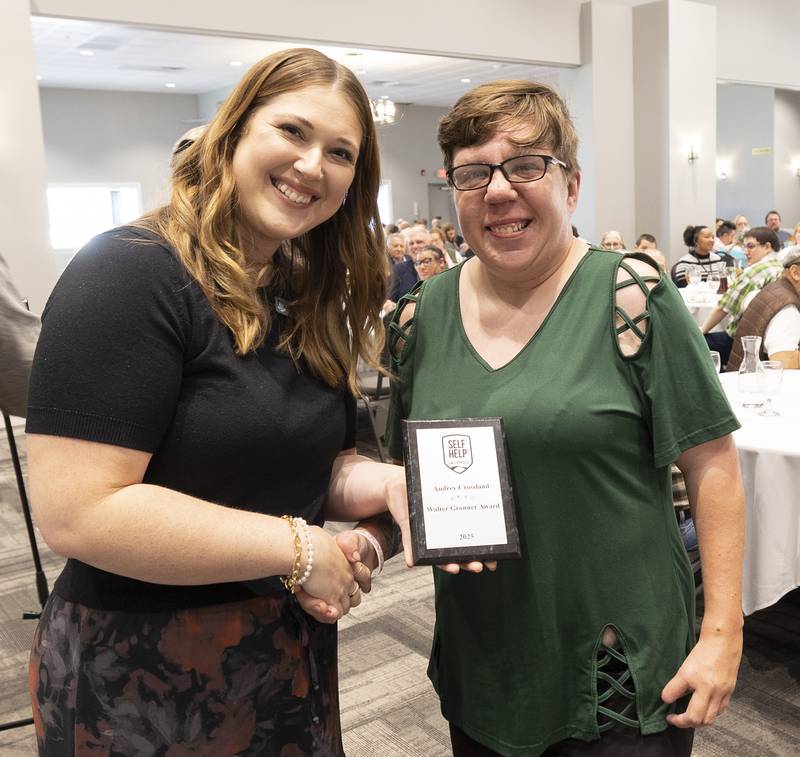Maggie Hofsommer presents Audrey Crossland with the Best Worker Award Thursday, Oct. 16, 2025, during the annual Self Help Awards.
