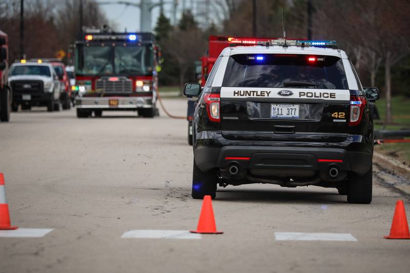 Huntley Police and Fire Department officers were on the scene of a crash Thursday afternoon, April 14, 2022, off of Ackman Road involving a vehicle that caught fire after leaving the road and ending up in a backyard. The two passengers were able to escape the vehicle and were sent to the hospital with minor injuries, fire department officials said.