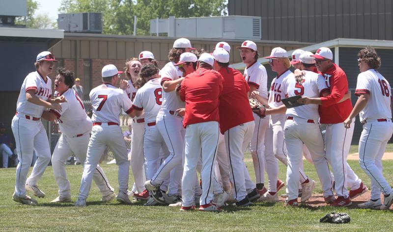 Members of the Hall beseball team gather behind home plate to celebrate knocking off Sherrard during the Class 2A Sectional final game on Saturday, May 27, 2023 at Knoxville High School.