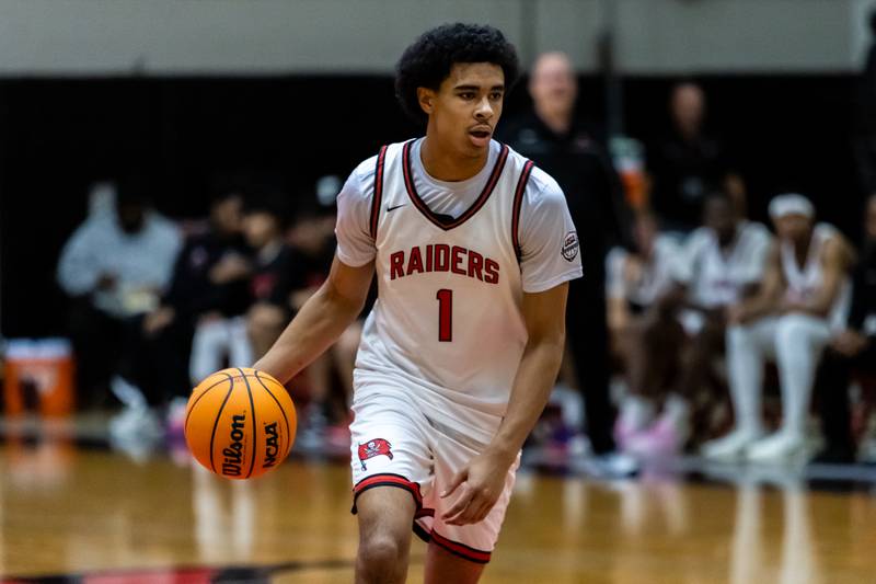 Bolingbrook's Brady Pettigrew prepares to make a play during a varsity boys basketball game against Oswego East at Bolingbrook on Dec. 12, 2025.