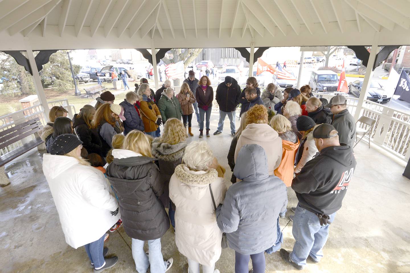 Protesters of the Drag Show gather and pray under the gazebo at Veteran's Park across from the Sandwich Opera House on Saturday, Feb. 18, 2023.