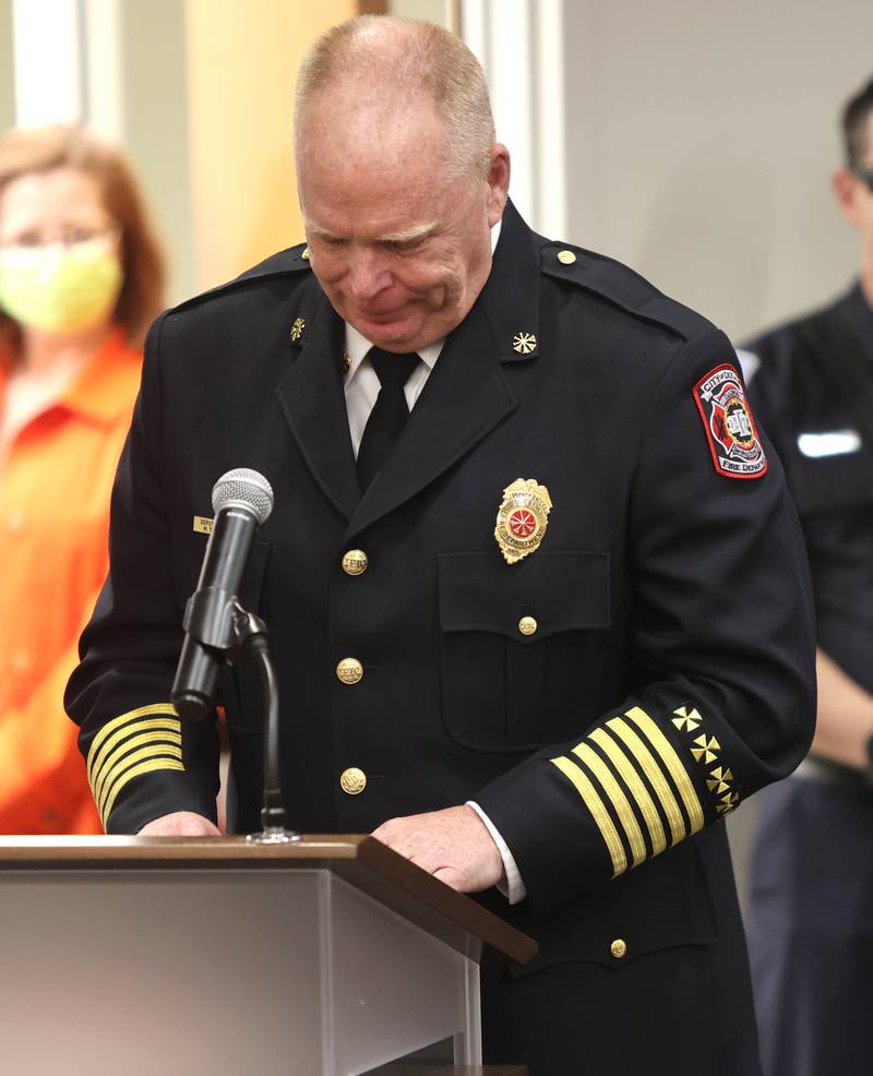 DeKalb Fire Chief Michael Thomas becomes emotional as he thanks his family after being sworn in as the city's new full-time fire chief Monday, April 11, 2022, during the DeKalb City Council meeting at the library. Thomas has been serving as the acting chief since the retirement of former chief Jeff McMaster in November.