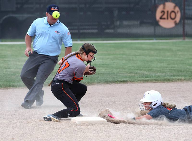 DeKalb's Gabby Kenney can’t corral the throw as Harlem's Adriah Sholl slides in with a stolen base Tuesday, May 19, 2026, during their Class 4A regional game at DeKalb High School.